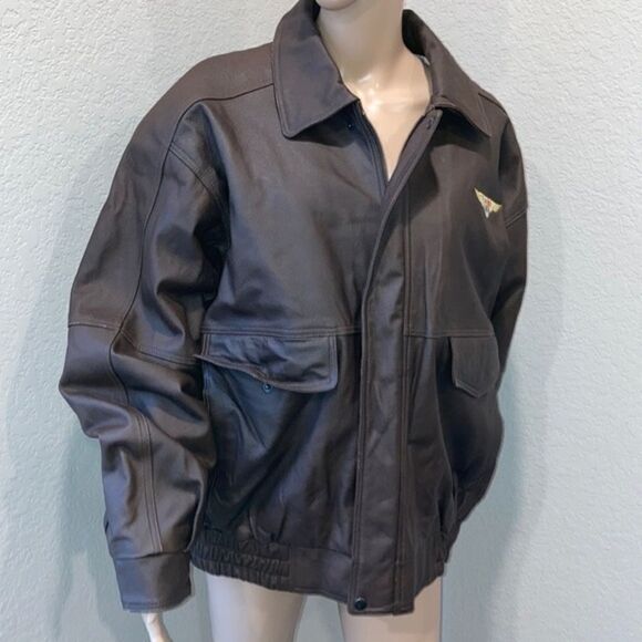Burks Bay  leather brown coat has a patch on the left side. - Picture 1 of 8